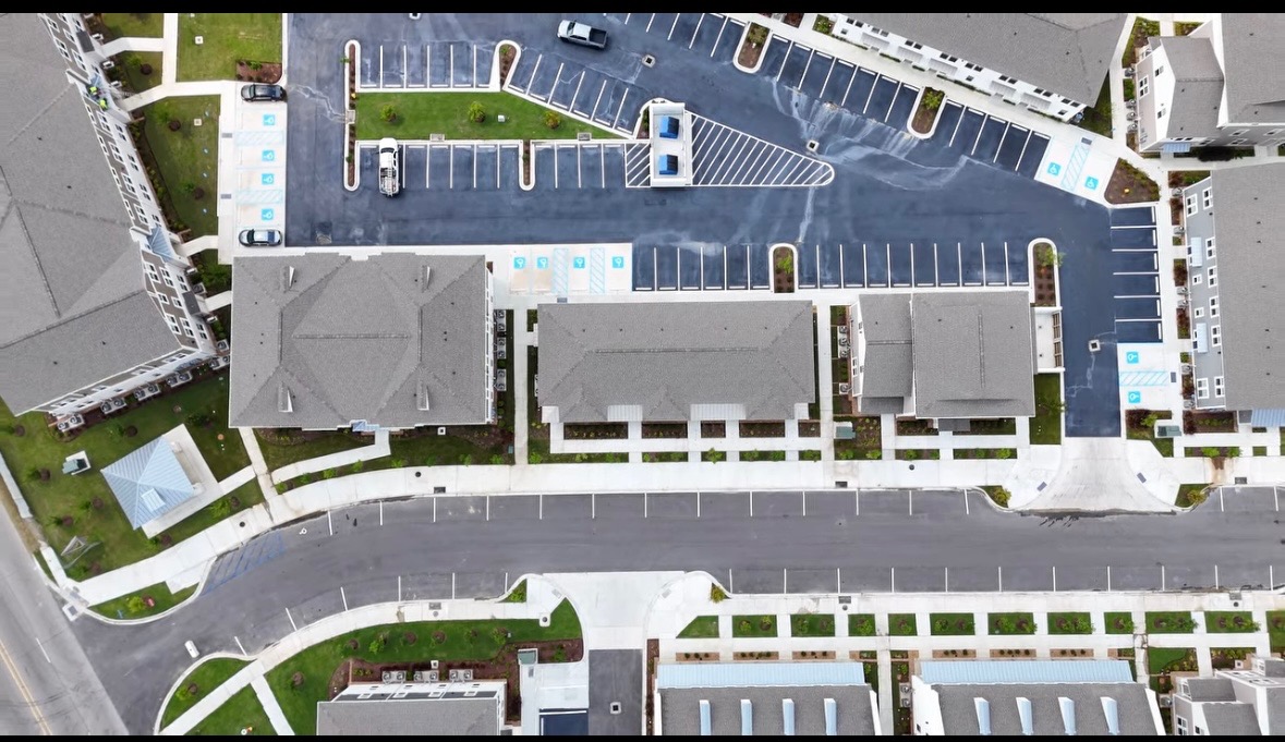 Aerial view of a newly striped apartment community parking lot
